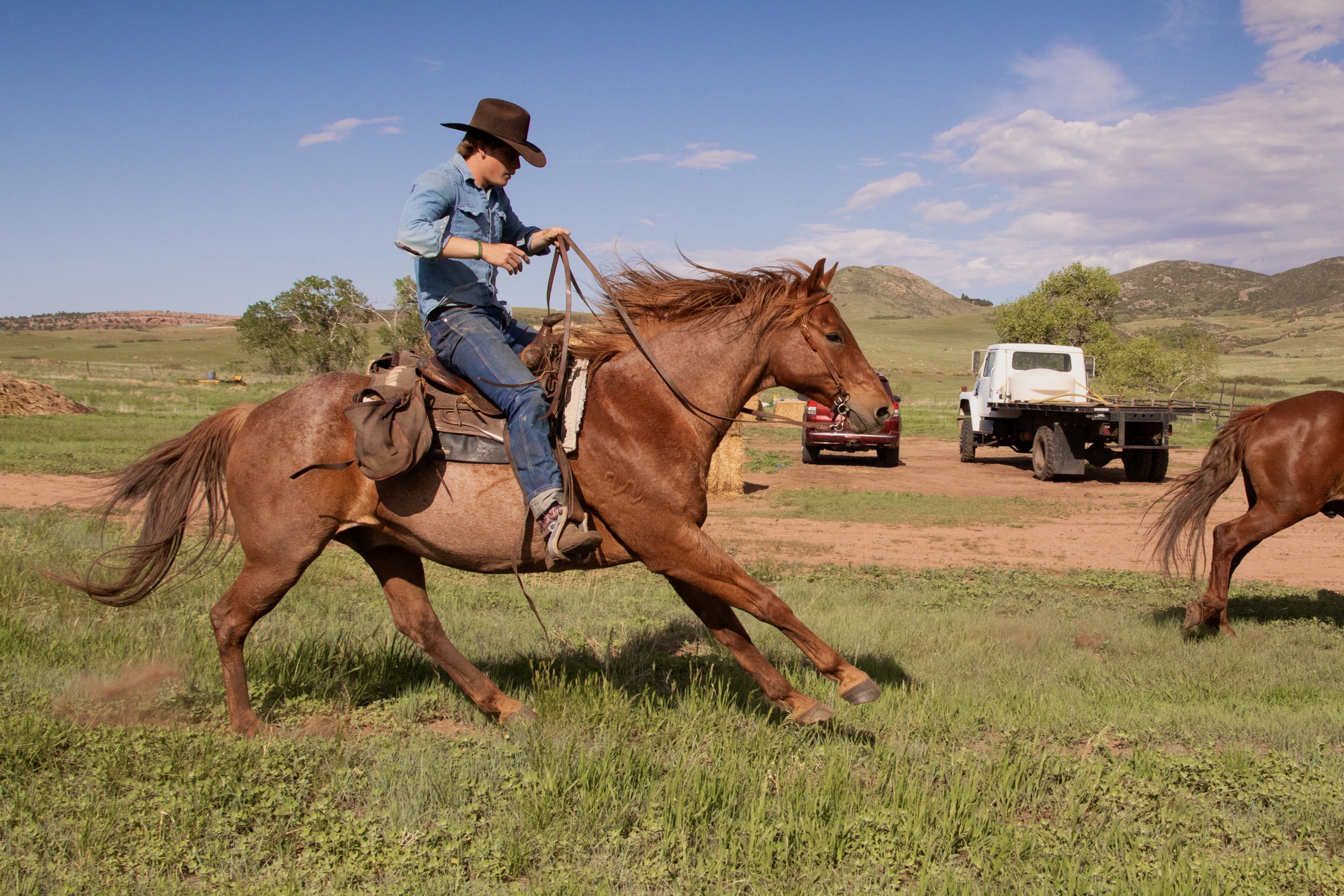 Samuel riding on the ranch